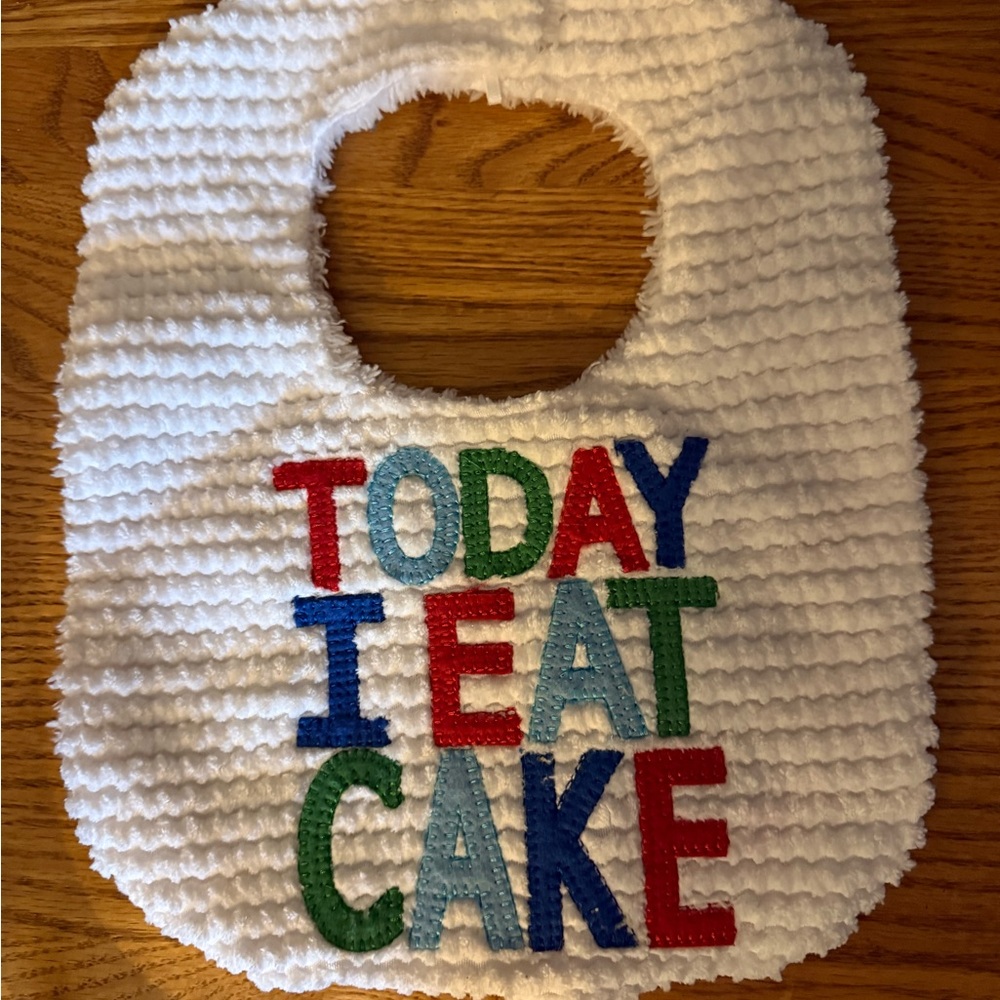 Mud Pie Plush White Baby Bib with Logo Patch